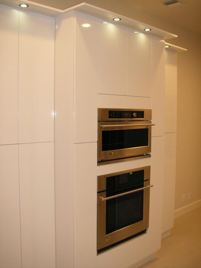 Tall custom pantry cabinets with built-in ovens